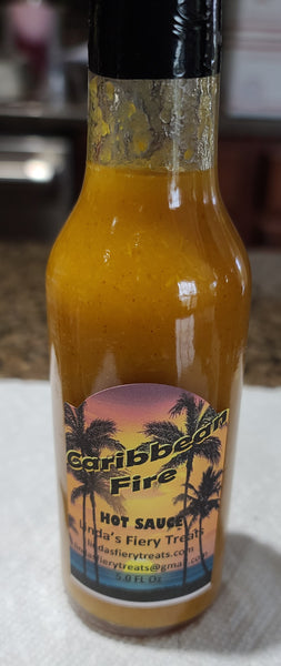 Caribbean Fire Hot Sauce - You will be feeling the heat of the islands with is yellow super hot pepper Caribbean Hot Sauce.  Made in limited small batches, using 64 yellow super hot peppers.  This is an extreme hot sauce.  Some of the included peppers are: CB7PY X 7Pot Mustard, Scotch Brain, Carbon Bhut, 7Pot yellow x Primo Yellow, Moruga Yellow, Goronong X 7Pot Yellow, White Ghost X Douglah yellow, 7Pot Yellow by Ed Currie, Devils Heart yellow, Peach Ghost, Fatalli, Carbonero Yellow