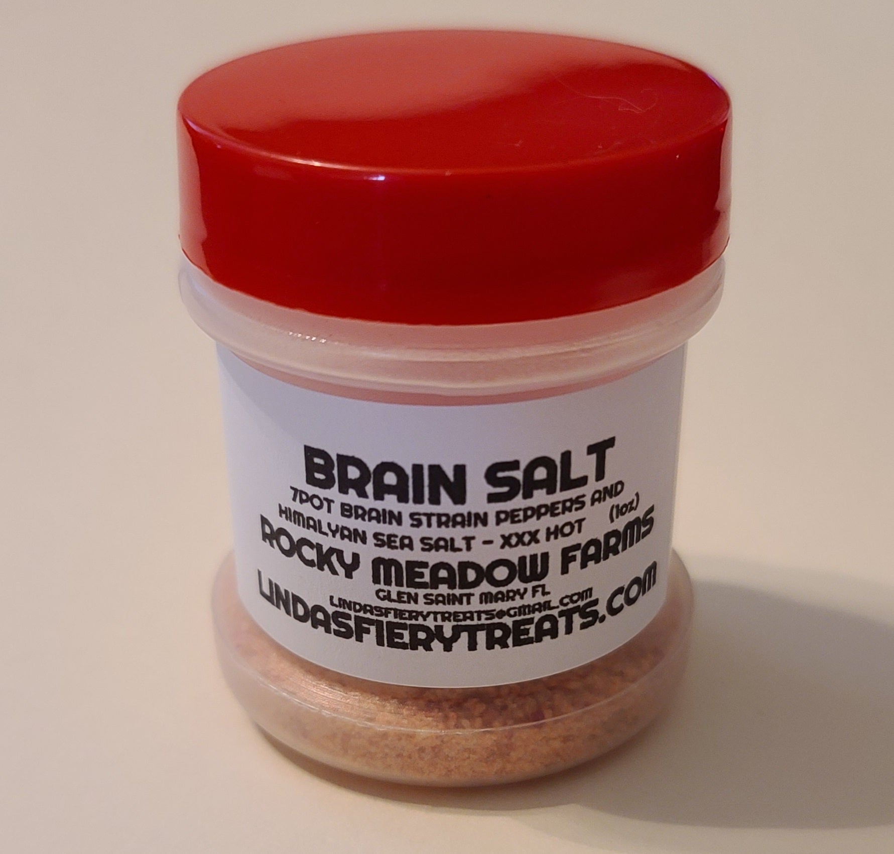 Brain Salt - Super spicy and flavorful finishing salt.  Gives any dish a great kick of heat.  Made with fresh 7-pot Brain Strain peppers and Himalayan sea salt.  This is easily one of our most popular items that folks quickly come back for more. - Ingredients: 7 Pot Brain Strain Peppers, Himalayan Sea Salt - XXX HOT